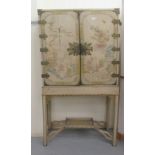 A 1920s/1930s chinoiserie decorated cocktail cabinet, overpainted with Oriental landscapes, the