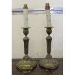 A pair of early 20thC lacquered brass candlestick style table lamps  17"h