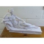 A modern carved white marble classical figure, a woman reclining on a daybed  12"h