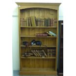 A modern waxed pine four tier, open front bookcase, on a plinth  77"h  44"w