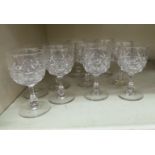 A set of ten slice and hobnail cut crystal pedestal sherries