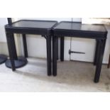 A pair of modern black painted lamp tables of elongated rectangular form, raised on square legs