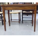A Regency mahogany foldover card table, raised on square legs  29"h  36"w