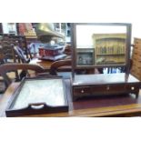 A 19thC mahogany framed toilet mirror, the plate pivoting on reeded horns and a three drawer box