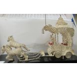 An Indian silver coloured metal filigree presentation model carriage pulled by two horses  6"h  10"L