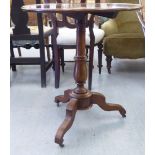 An early 19thC mahogany tip-top pedestal table, over a ring turned vase column, raised on a