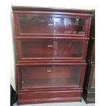 An early 20thC Globe Wernicke mahogany sectional bookcase, comprising three tiers with a cornice and