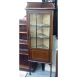 An Edwardian satin and inlaid mahogany corner cabinet with a single astragal glazed door, raised