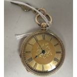 An 18ct gold cased pocket watch with bright-cut engraved ornament, faced by an engine turned and