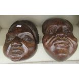 Two similar carved African hardwood masks  18"h