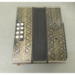 A vintage twenty-one key Hohner piano accordion
