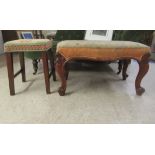 A 19thC carved mahogany framed serpentine outlined stool with an overstuffed and tapestry