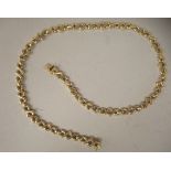 An 18ct gold cast crossover link necklace, on a bayonet clasp