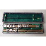 A flute, in a fitted fabric lined carrying case