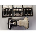 A set of six silver teaspoons; a set of six bean and coffee spoons; and another set of six of