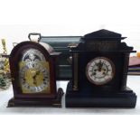 A late Victorian black slate cased architectural style mantel clock; the bell strike movement with a