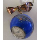 A floral decorated, engine turned ball watch, on a 9ct gold ribbon tied bow brooch and safety chain