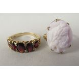 A 9ct gold claw set cameo portrait ring; and a 9ct gold and garnet set dress ring