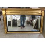 A late Victorian overmantel mirror, set in an ornate gilt gesso breakfront frame  35" x 54"