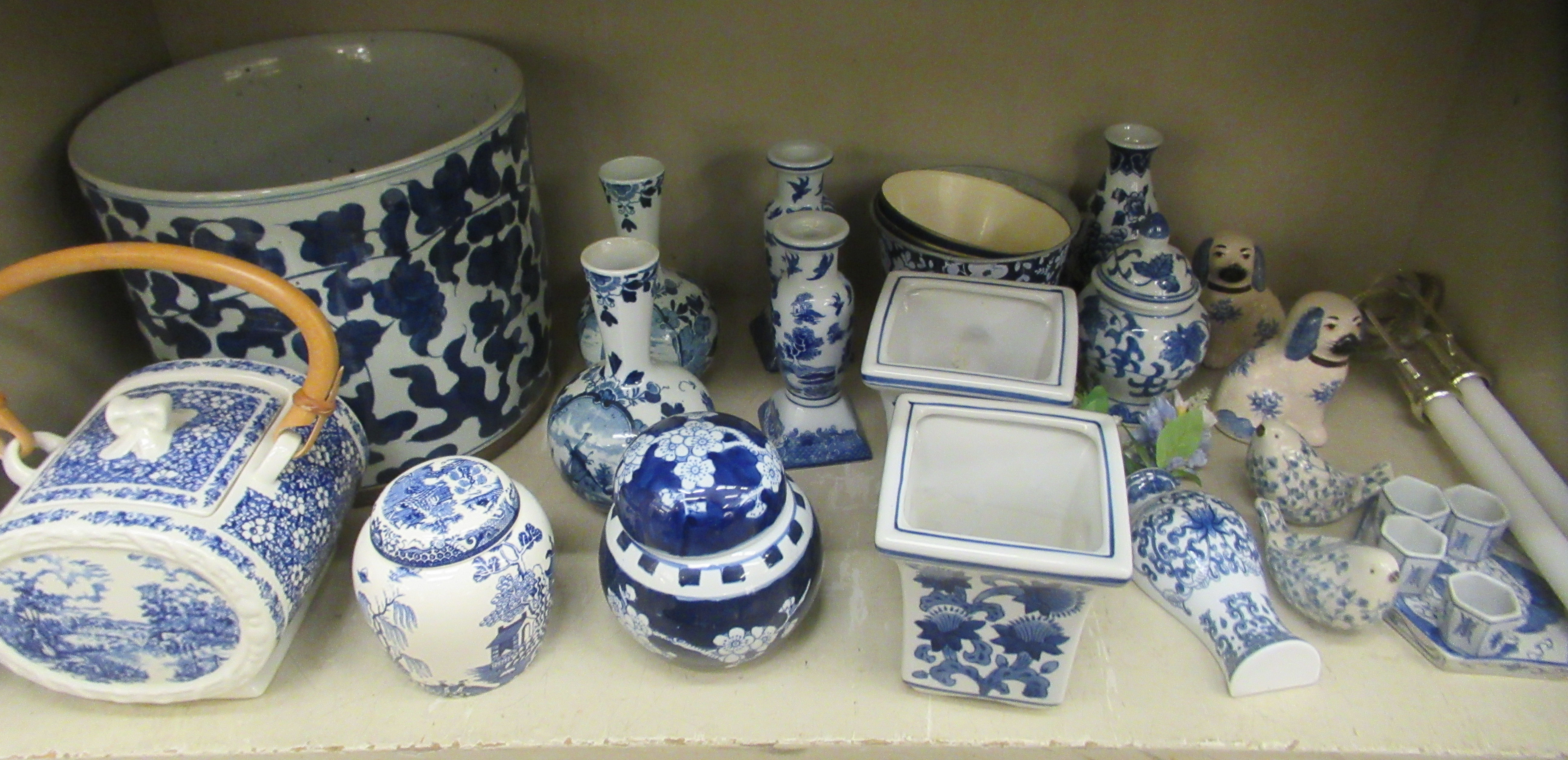 Blue and white ceramics: to include a porcelain planter  9"h  9.5"dia; and two ginger jars