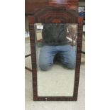 An Art Deco mirror, the bevelled plate set in a burr walnut and fruitwood veneered frame  26" x 13"