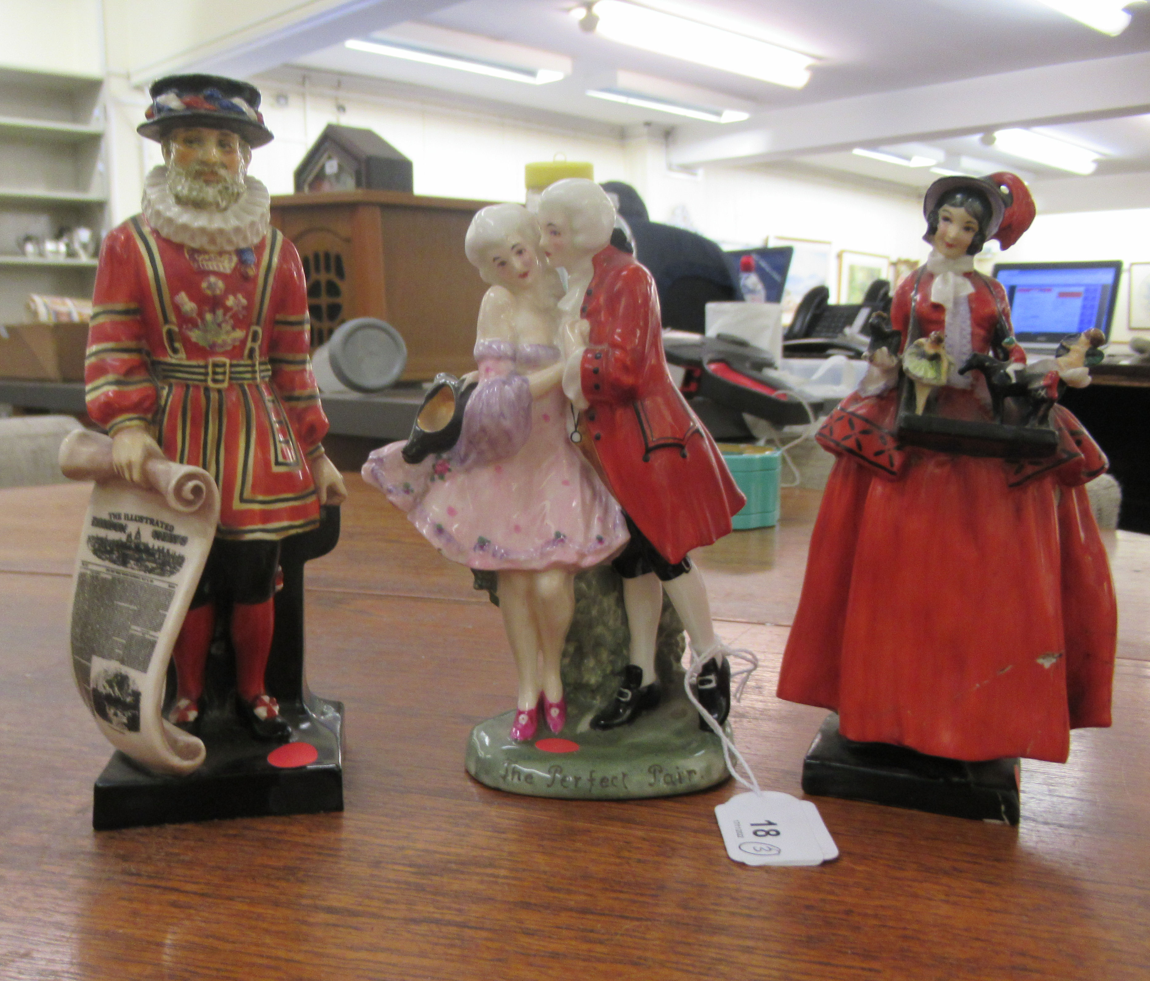 Three Royal Doulton china figures, 'Beefeater'  7.5"h; 'The Perfect Pair'  7"h; and a young woman