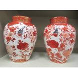 A pair of late 19th/early 20thC Japanese porcelain tea caddies, traditionally decorated in red and