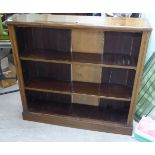 A late Victorian oak and mahogany two tier, open fronted bookcase, on a plinth  45"h  48"w