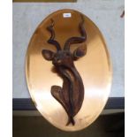 Pat Johnson - a composition carving, a deer's head, mounted on an oval copper plaque  24"h
