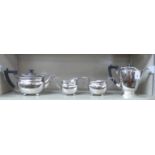 A George VI Elkington & Co four piece silver tea set  comprising a tea pot, coffee pot, sugar