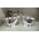 An Elkington & Co George VI silver three piece tea set  comprising a teapot, sugar basin and cream