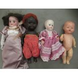 Four 20thC dolls: to include a porcelain example  bears marks S.L.H / J.D.K  8"h