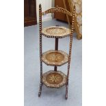 An early/mid 20thC Indian inspired bone inlaid fruitwood three tier cakestand, on splayed feet  31"h