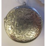 A late Victorian silver disc shape vesta case with a pendant ring, hinged cap, strike plate and