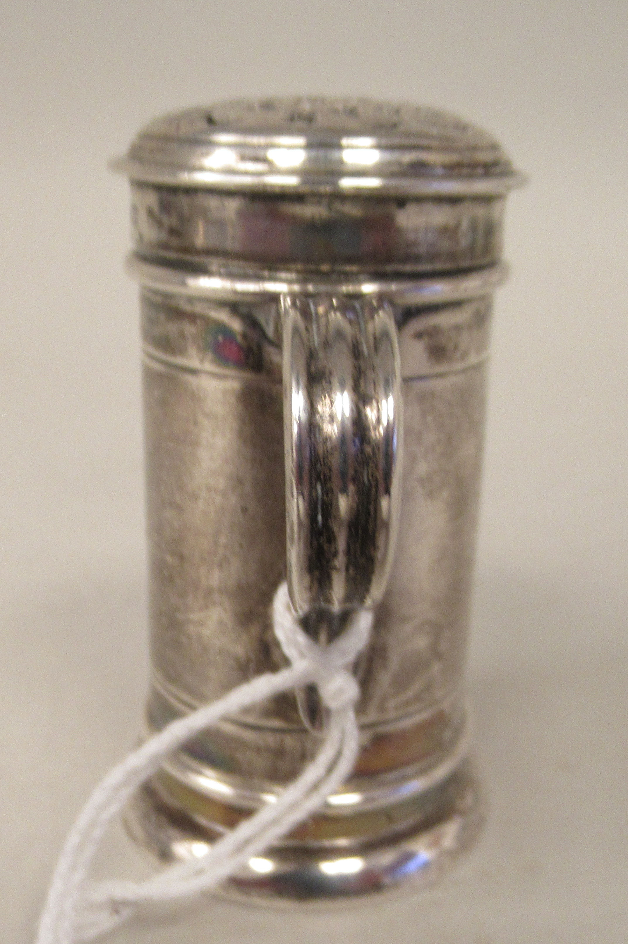 A late Victorian silver sander of cylindrical form with an S-shape handle and decoratively pierced - Image 4 of 8