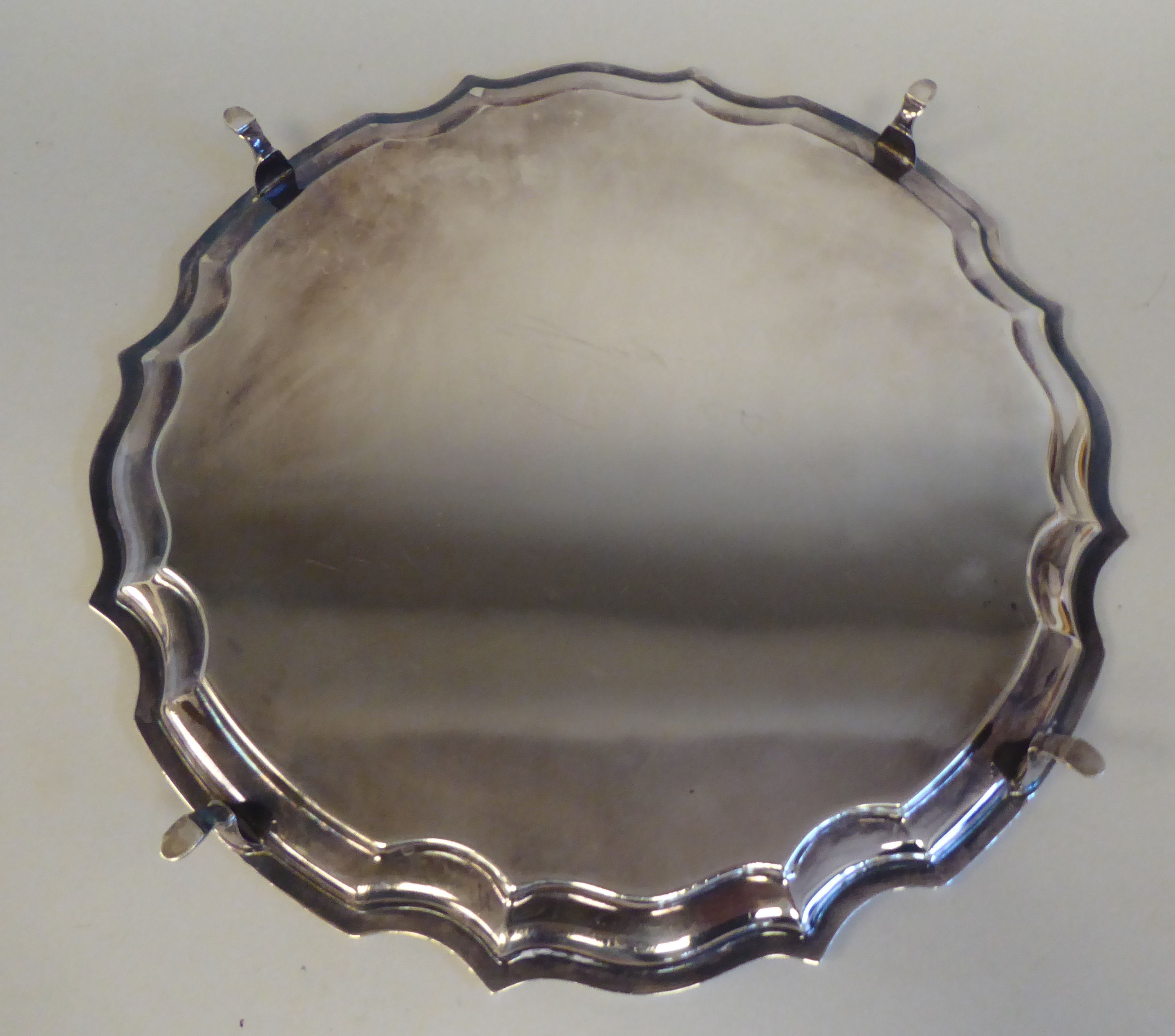 A Georgian style silver salver with a raised piecrust border, on pad feet  Peyton, Pepper & Sons - Image 2 of 3