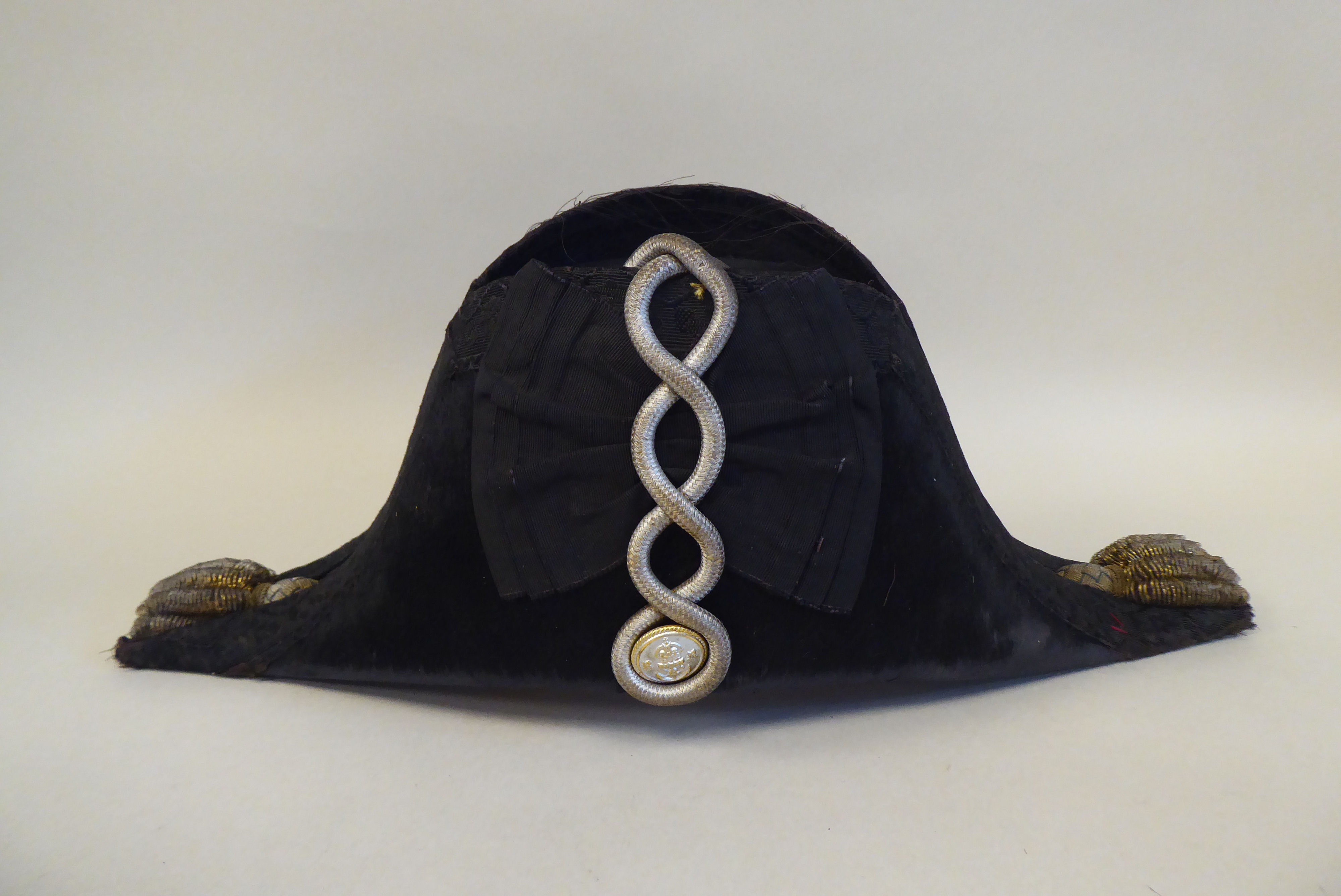 A naval black cocked hat with braid and a feather plume, size 7, in a painted tinplate box  ( - Image 2 of 16