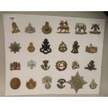 Twenty-four military cap badges and other insignia, some copies: to include The Life Guards; The