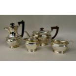 A four piece silver tea set of ogee form with applied wire, wavy rims  comprising a teapot with an