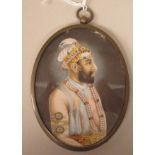 A late 19thC oval half length portrait miniature, a bearded man wearing Persian costume with