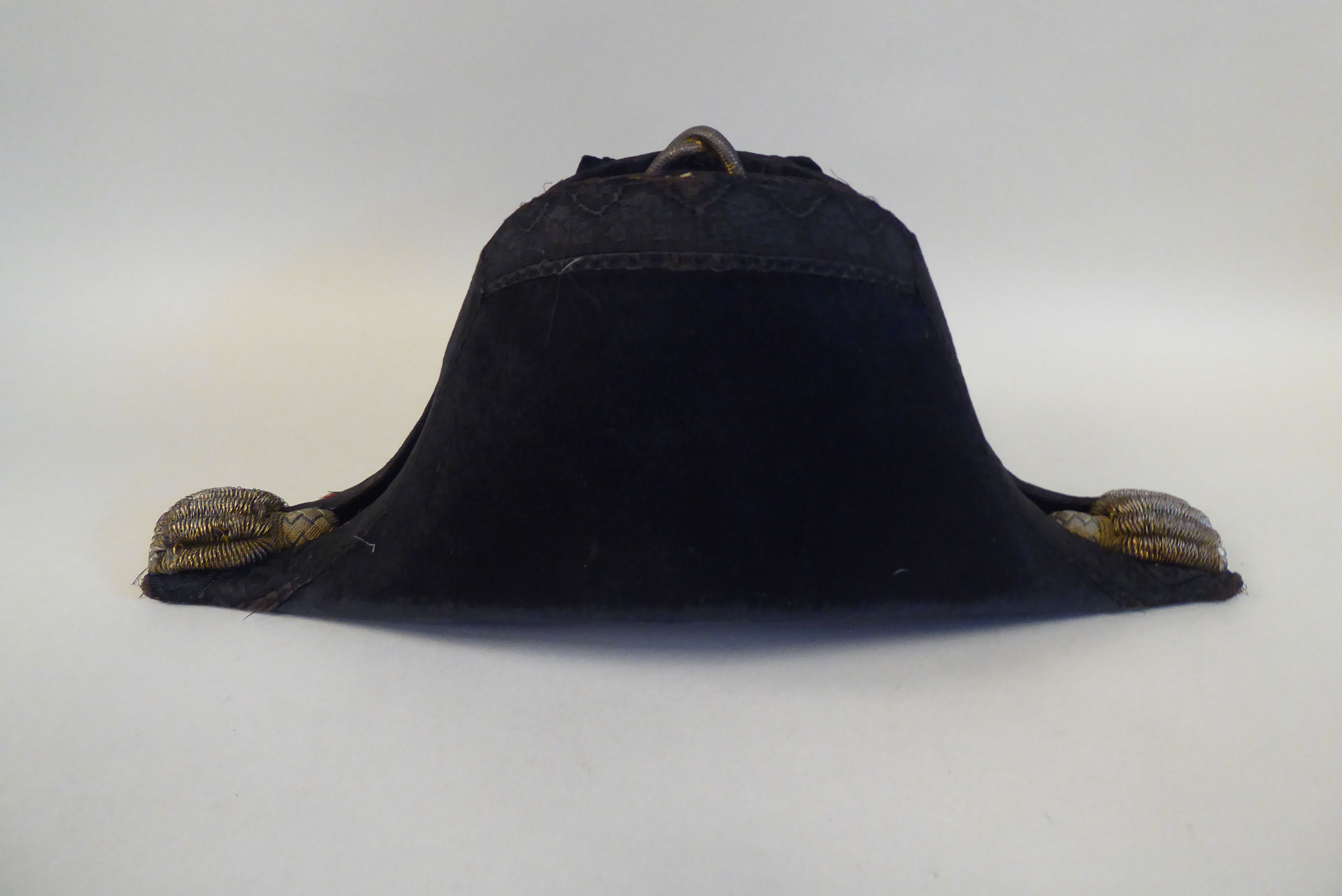 A naval black cocked hat with braid and a feather plume, size 7, in a painted tinplate box  ( - Image 4 of 16
