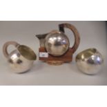 An Art Deco inspired three piece spot-hammered silver tea set of spherical form  comprising a teapot