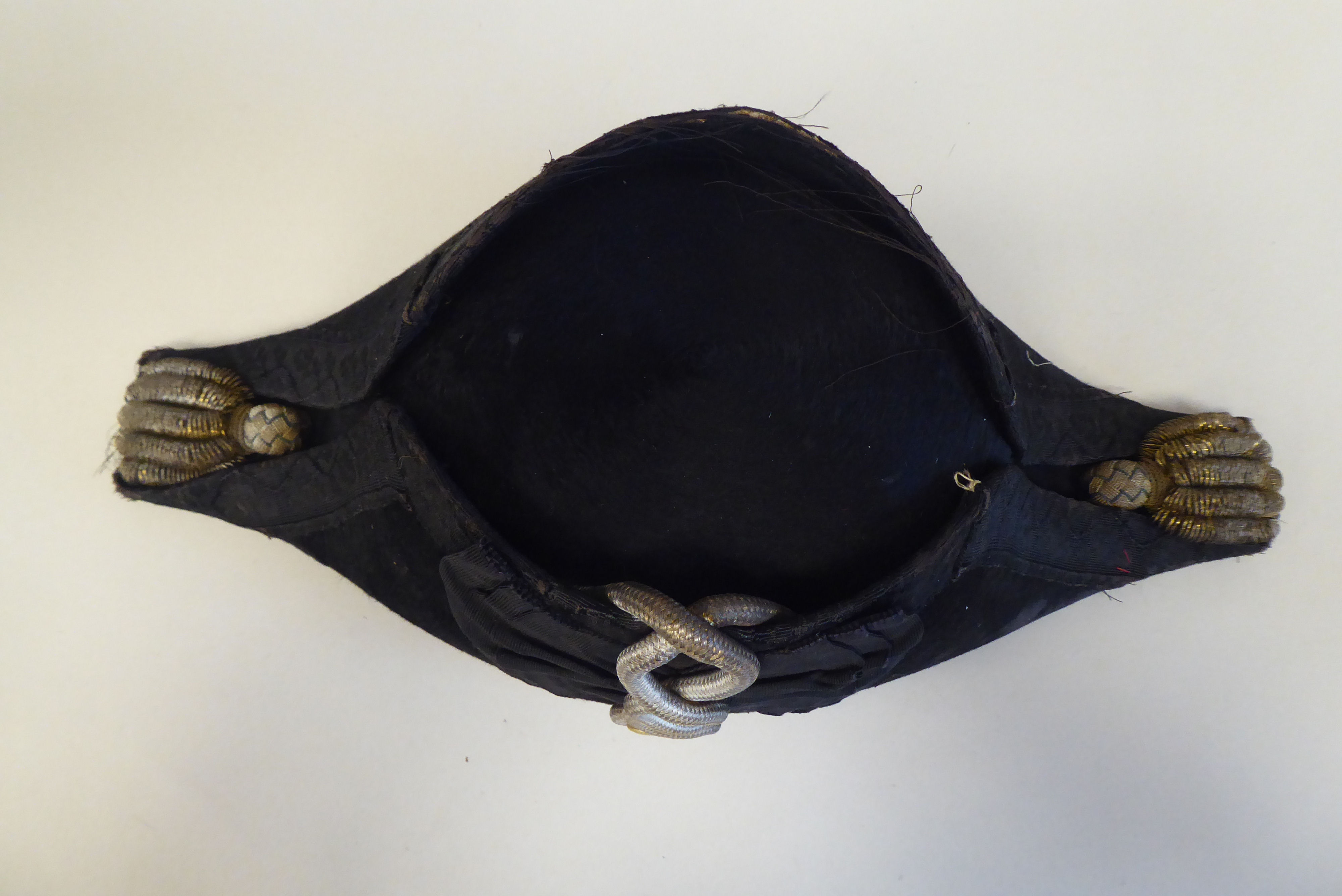 A naval black cocked hat with braid and a feather plume, size 7, in a painted tinplate box  ( - Image 6 of 16