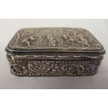 An Edwardian silver trinket box with straight sides and a hinged lid, repousse worked with 18thC