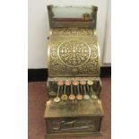 A late 19thC National of Daytan, Ohio cast brass No.5 cash register with a lockable hinged cover,