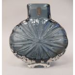 A Whitefriars indigo coloured glass 'Sunburst' vase, designed by Geoffrey Baxter  bears a printed