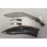 An Asian Kukri with a brass mounted hardwood handle  the blade 12"L with a pair of skinning