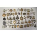 Approx. fifty military cap badges and other insignia, some copies: to include County of London