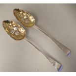 A pair of George III Scottish silver and parcel gilt Old English pattern berry spoons with scratch