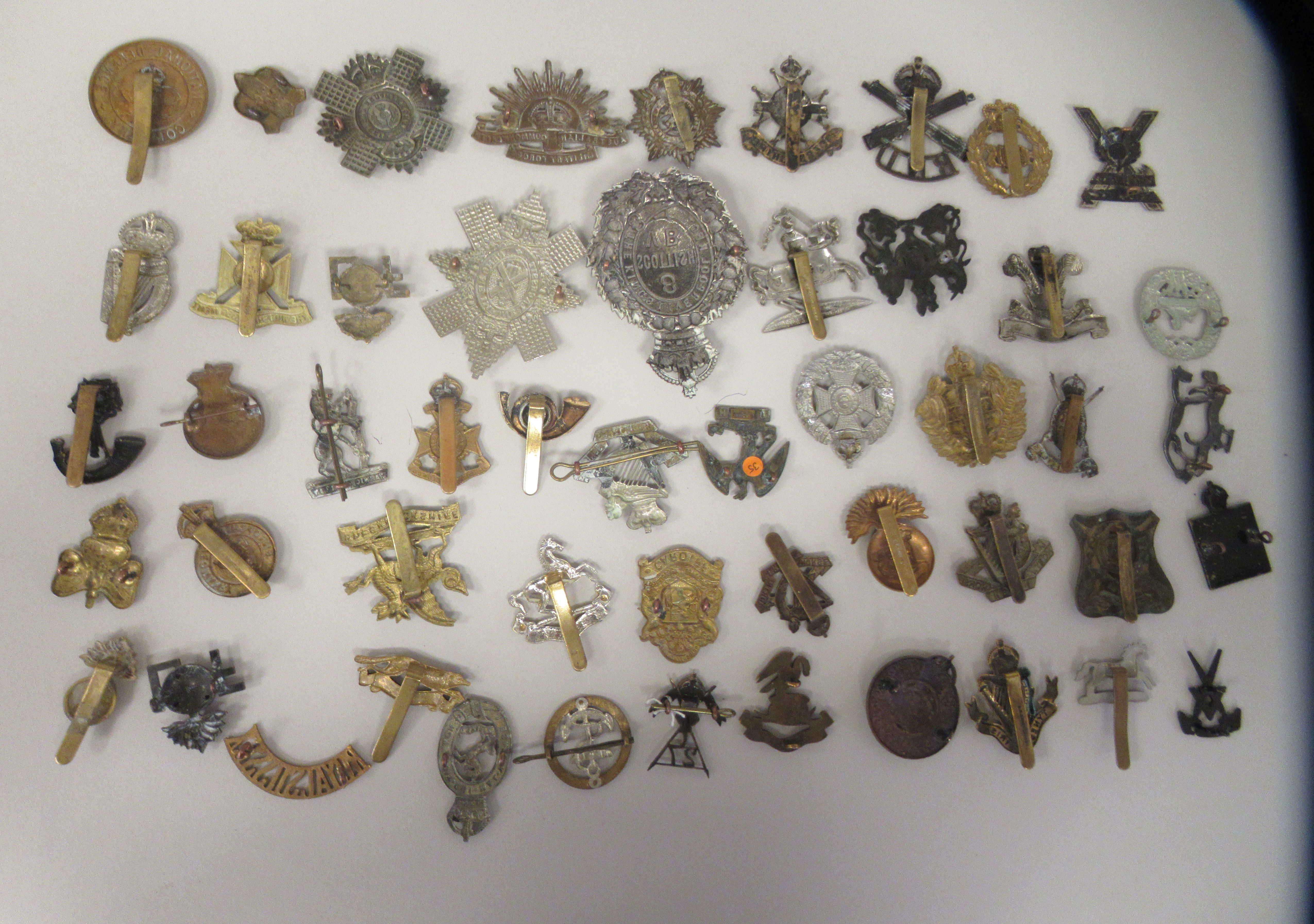 Approx. fifty military cap badges and other insignia, some copies: to include Kings Liverpool Regt.; - Image 6 of 6